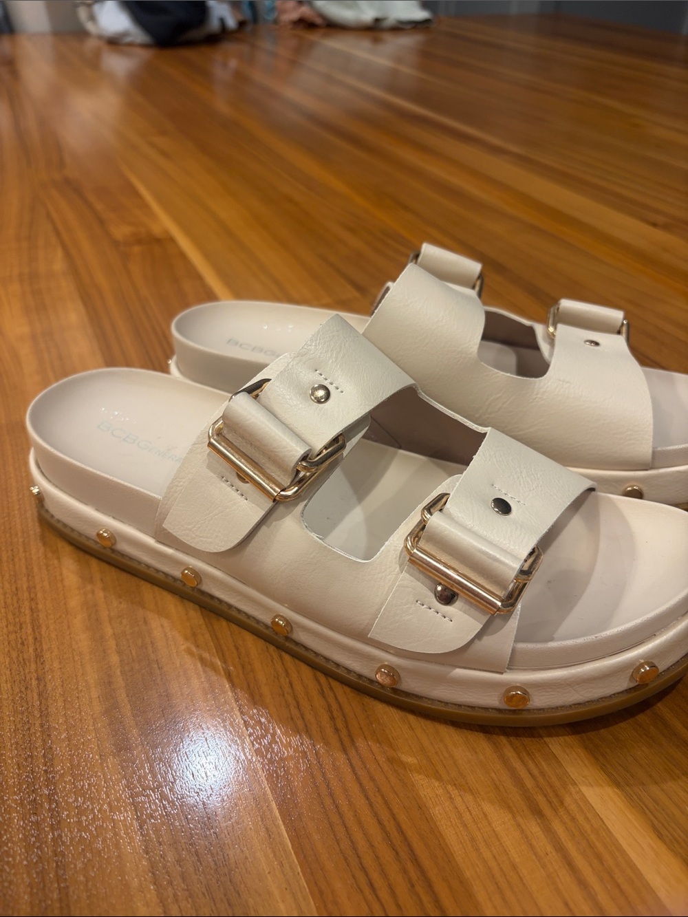 BCBGeneration Cream Double-Buckle Slide Sandals with Gold Accents